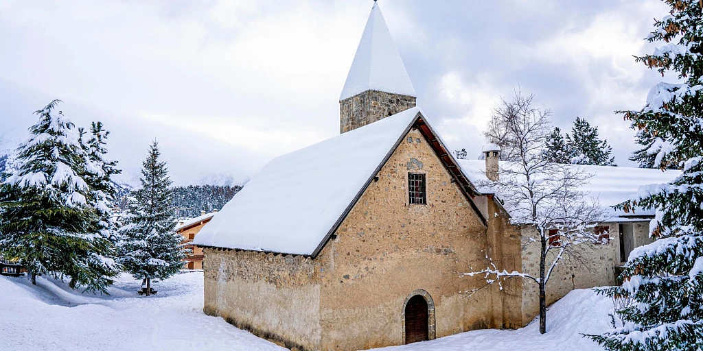 Pretty snowy church in Auron, French Alps